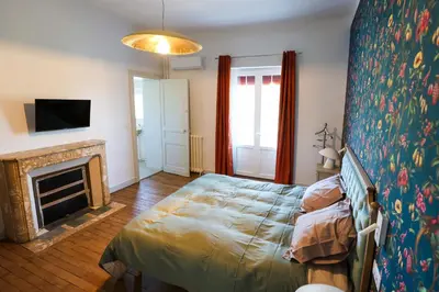 Un ou plusieurs lits dans un hébergement de l'établissement Villa Pomade