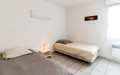 Un ou plusieurs lits dans un hébergement de l'établissement Maison de vacances Navarrosse