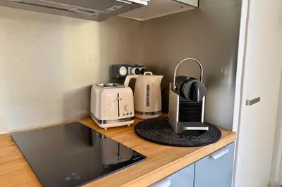 Cuisine ou kitchenette dans l'établissement Le Cottage Détente