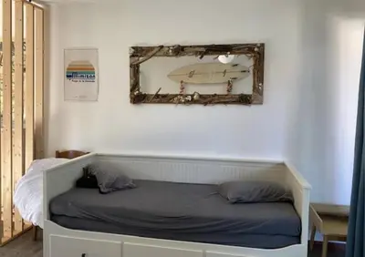 Un ou plusieurs lits dans un hébergement de l'établissement Studio avec jardinet Mimizan plage