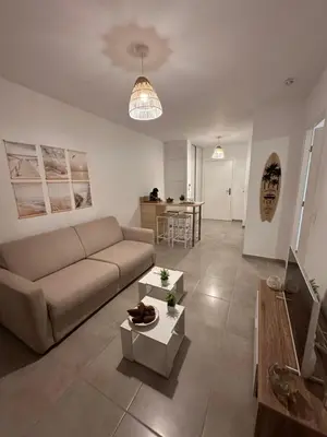 Coin salon dans l'établissement À 500m de la plage - L Ébène -