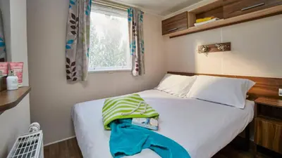 Un ou plusieurs lits dans un hébergement de l'établissement Camping Lou Pignada