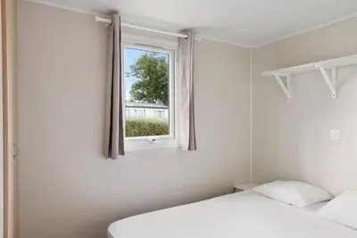 Un ou plusieurs lits dans un hébergement de l'établissement Camping Lou Pignada