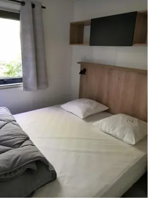 Un ou plusieurs lits dans un hébergement de l'établissement Mobilhome Premium