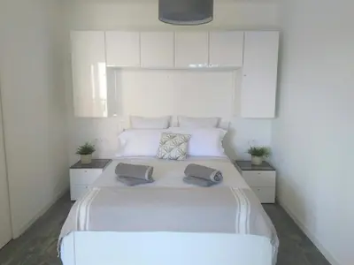 Un ou plusieurs lits dans un hébergement de l'établissement Ambiance Cosy Capbreton