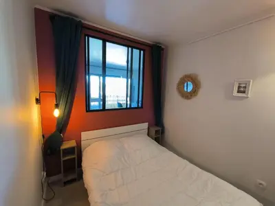 Un ou plusieurs lits dans un hébergement de l'établissement Appartement Mimizan Plage