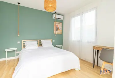 Un ou plusieurs lits dans un hébergement de l'établissement Escapade Chez Max - Proche du port 3 CH