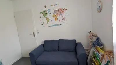 Coin salon dans l'établissement Appartement avec jardin proche de l'océan
