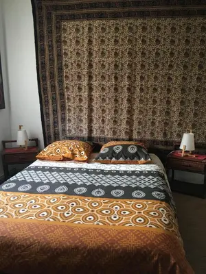 Un ou plusieurs lits dans un hébergement de l'établissement La Chambre Du Voyageur