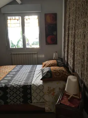 Un ou plusieurs lits dans un hébergement de l'établissement La Chambre Du Voyageur