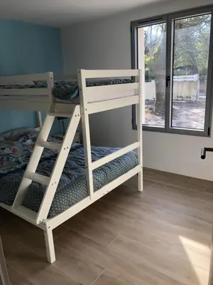 Un ou plusieurs lits dans un hébergement de l'établissement Maison 6 à 8 pers au bord du Lac de Biscarrosse