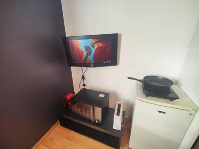 Télévision ou salle de divertissement dans l'établissement La Suite Soleil