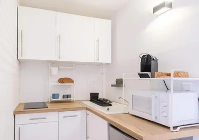 Cuisine ou kitchenette dans l'établissement Vagues & Bord de Plage