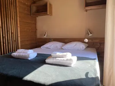 Un ou plusieurs lits dans un hébergement de l'établissement Chalet du Bassin Arcachon - Camping Parc aquatique