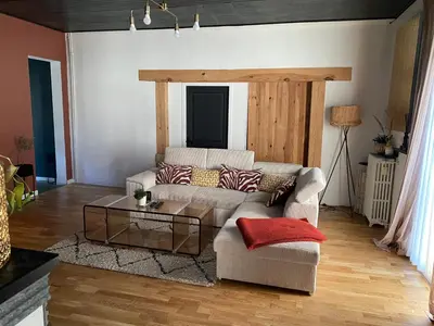Coin salon dans l'établissement Charmante maison de famille avec jardin