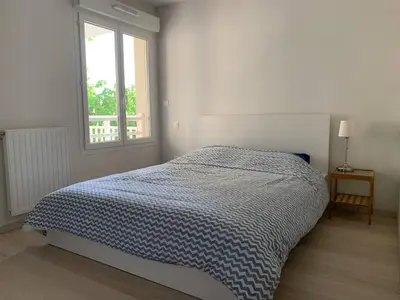 Un ou plusieurs lits dans un hébergement de l'établissement Appartement Gujan Mestras premier étage