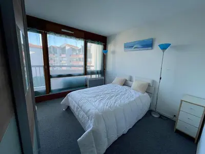 Un ou plusieurs lits dans un hébergement de l'établissement Appartement cosy 4 pers avec piscine et parking à Capbreton - FR-1-413-256