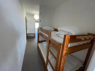Un ou plusieurs lits dans un hébergement de l'établissement Appartement cosy 4 pers avec piscine et parking à Capbreton - FR-1-413-256