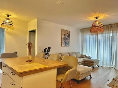Coin salon dans l'établissement Appartement plage et lac