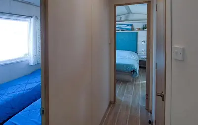 Un ou plusieurs lits dans un hébergement de l'établissement Beautiful Stacaravan