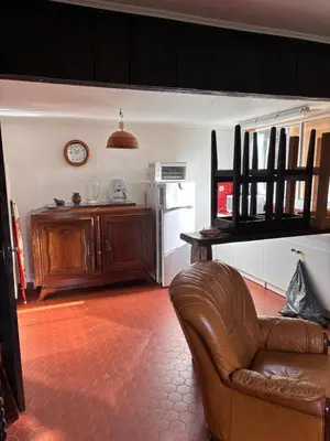 Coin salon dans l'établissement T1 charme Landais à la ferme