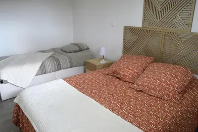 Un ou plusieurs lits dans un hébergement de l'établissement Petite maison de plain-pied