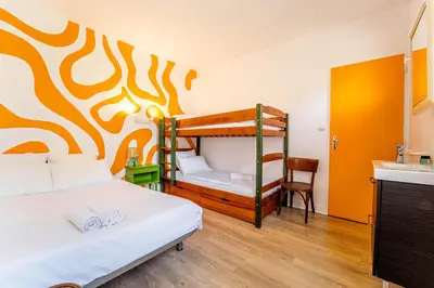 Un ou plusieurs lits dans un hébergement de l'établissement Au Bon Landais Surf Hôtel