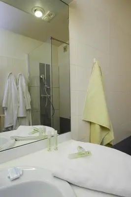 Salle de bains dans l'établissement Residence Les Chenes