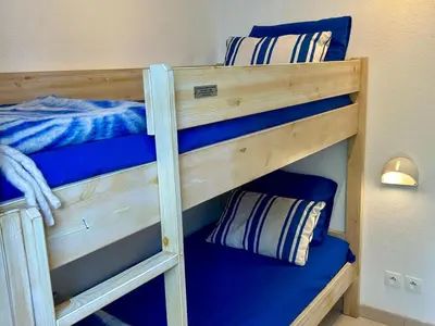 Un ou plusieurs lits dans un hébergement de l'établissement Maison confortable 6 pers, terrasse, résidence avec piscine et parking proche mer - FR-1-239-1118