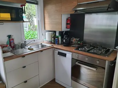 Cuisine ou kitchenette dans l'établissement Détente et Lac
