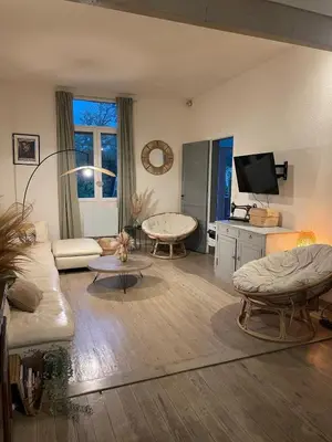 Télévision ou salle de divertissement dans l'établissement Maison chaleureuse Bassin d Arcachon