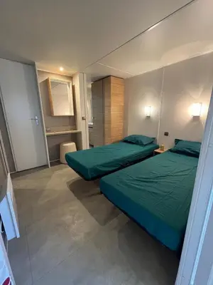 Un ou plusieurs lits dans un hébergement de l'établissement Mobile Home 6 personnes