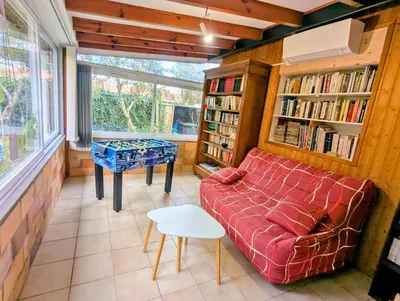 Coin salon dans l'établissement Maison 3 étoiles climatisée, jardin, parking, proche centre et thermes