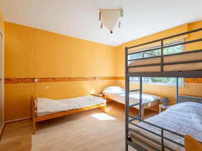 Un ou plusieurs lits dans un hébergement de l'établissement Maison familiale 5 chambres pour 14 pers, vue lac à Biscarrosse - FR-1-319-605