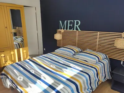 Un ou plusieurs lits dans un hébergement de l'établissement L'appartement Verdalle, proche de la plage de La Hume