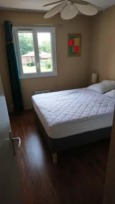 Un ou plusieurs lits dans un hébergement de l'établissement Appartement cosy au calme à Léon