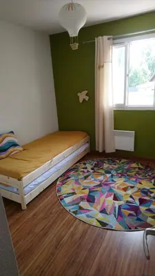 Un ou plusieurs lits dans un hébergement de l'établissement Appartement cosy au calme à Léon