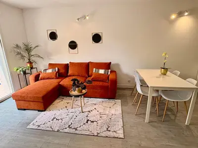 Coin salon dans l'établissement Appartement cosy, terrasse privée, parking, centre ville