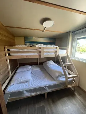 Un ou plusieurs lits dans un hébergement de l'établissement Mobil home G11 tout confort