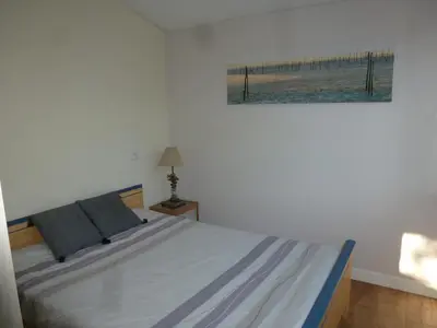 Un ou plusieurs lits dans un hébergement de l'établissement Maison style chalet au calme