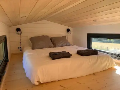 Un ou plusieurs lits dans un hébergement de l'établissement Tiny House Lou Cabanot