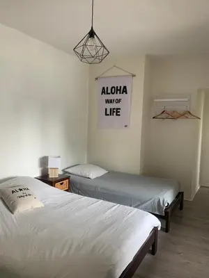 Un ou plusieurs lits dans un hébergement de l'établissement Hôtel La Cote d'Argent