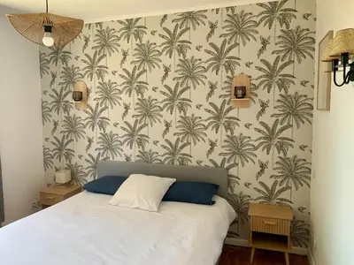 Un ou plusieurs lits dans un hébergement de l'établissement La villa Jeanne- Charmante maison avec très belle terrasse couverte à 10 min du centre de Salies de Bearn