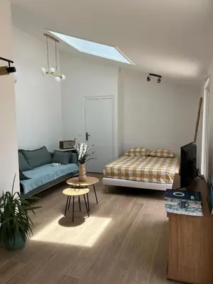 Un ou plusieurs lits dans un hébergement de l'établissement Studio neuf avec Terasse Jardin