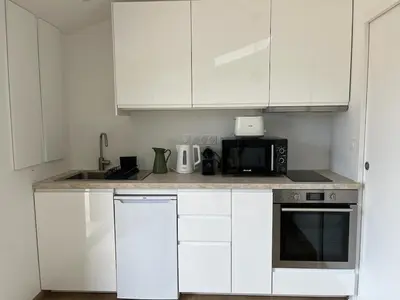 Cuisine ou kitchenette dans l'établissement Studio neuf avec Terasse Jardin
