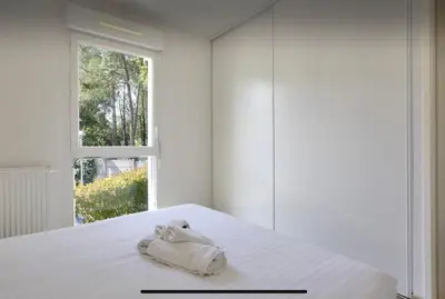 Un ou plusieurs lits dans un hébergement de l'établissement Appartement Lumineux et Calme