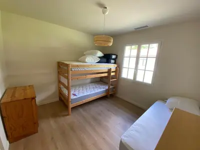 Un ou plusieurs lits dans un hébergement de l'établissement Les Nids de Galleben - La Villa Mimizan