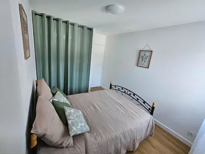 Un ou plusieurs lits dans un hébergement de l'établissement Appartement 2 chambres