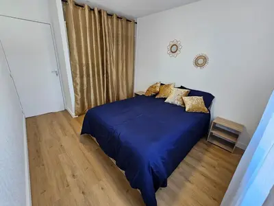 Un ou plusieurs lits dans un hébergement de l'établissement Appartement 2 chambres