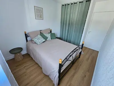 Un ou plusieurs lits dans un hébergement de l'établissement Appartement 2 chambres